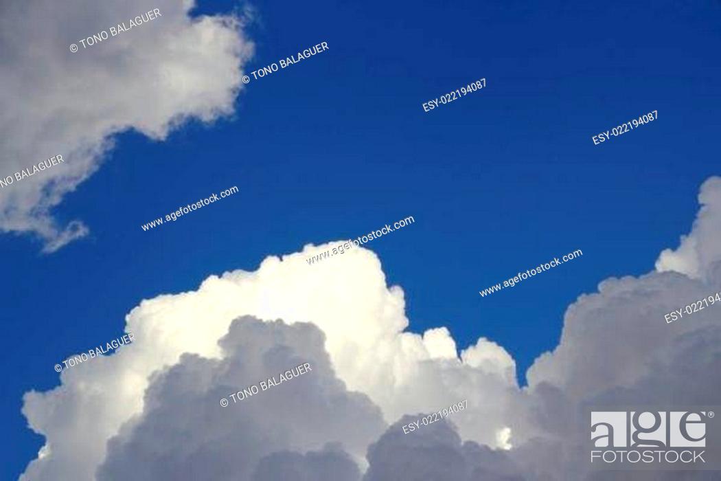 Stock Photo: cumulus clouds dramatic blue sky cloudy.