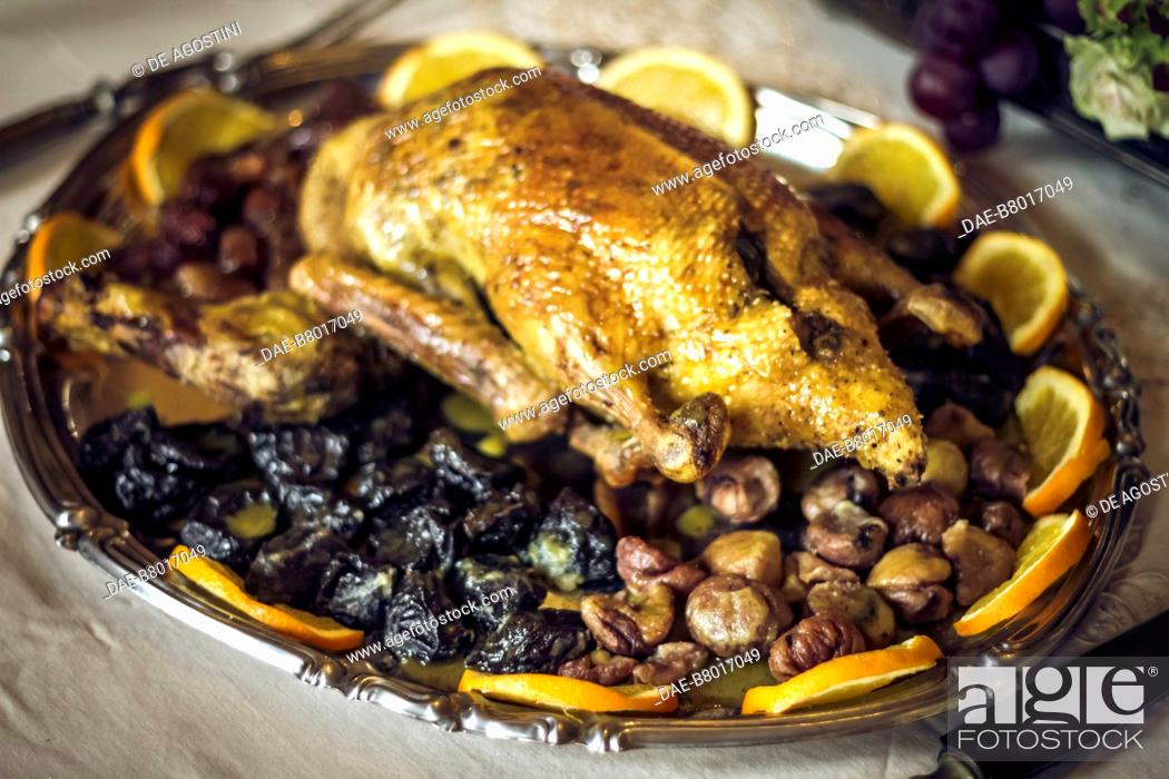 Stock Photo: Roast guinea fowl with chestnuts and prunes, court life in the Stupinigi hunting lodge, Italy, 18th century. Historical re-enactment.