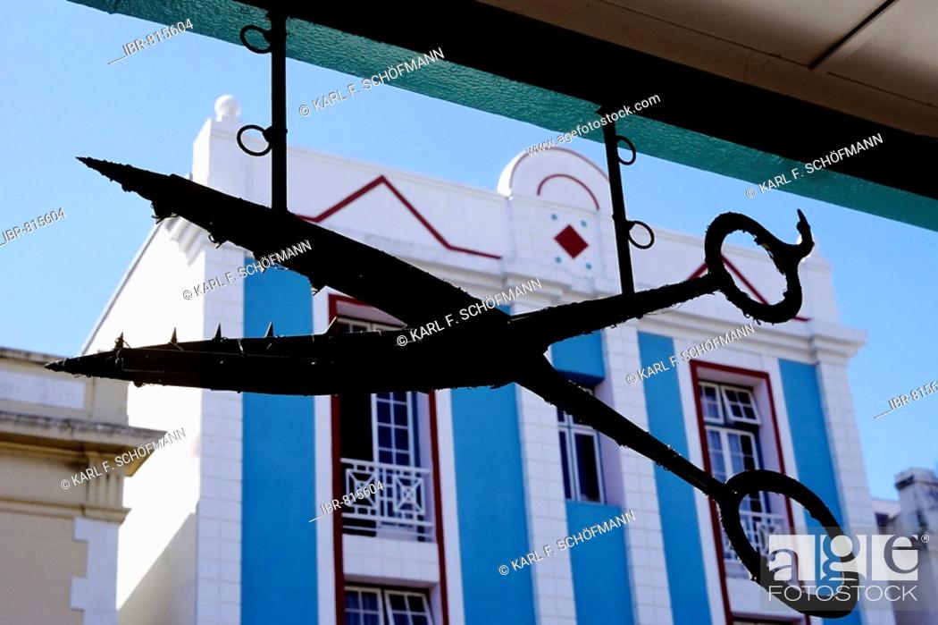 Big iron scissors hanging above a shop, sign of a hair salon on Long  Street, Cape Town, Stock Photo, Picture And Rights Managed Image. Pic.  IBR-815604 | agefotostock