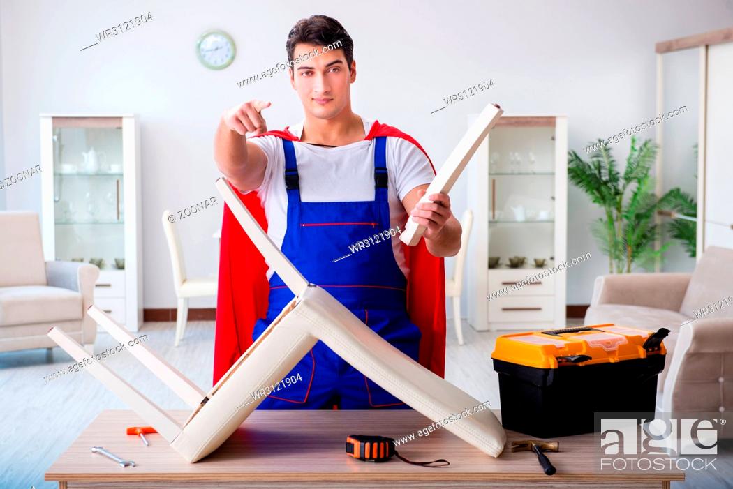 Photo de stock: Superhero repairman with tools in repair concept.