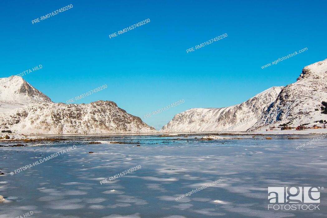 Stock Photo: Looking from the E10 near Vareid over the frozen Flakstadpollen, Flagstadøya, Lofoten, Nordland, Norway, March 2017 / Blick von der E10 bei Vareid über den.