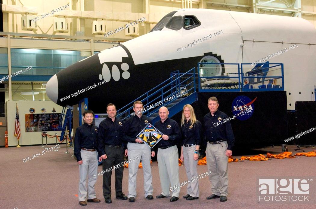 Stock Photo: The STS-124 crewmembers take a moment to pose for a portrait during a training session in the Space Vehicle Mockup Facility at the Johnson Space Center.