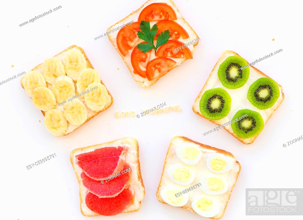 Stock Photo: bright mix of sandwiches for breakfast, good morning inscription.