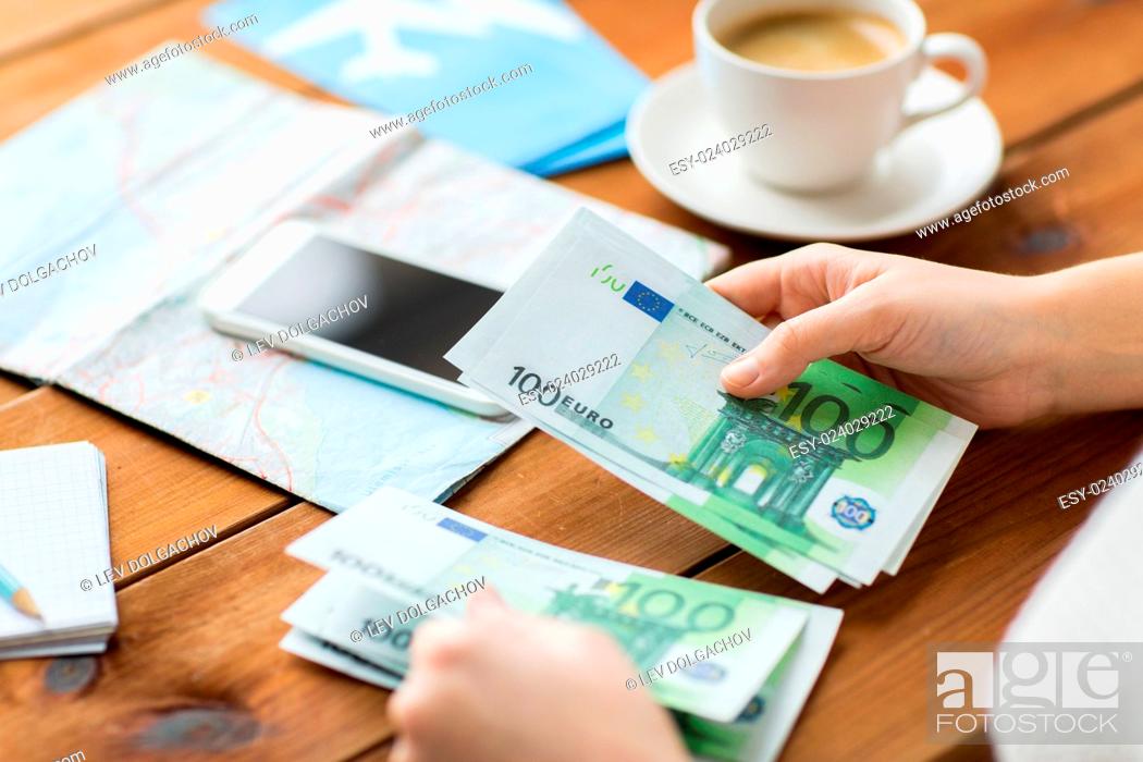 Stock Photo: vacation, tourism, travel, finances and people concept - close up of traveler hands counting euro cash money.