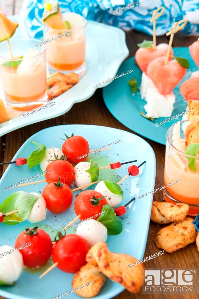 Stock Photo: Little skewers with tomatoes, mozzarella cheese and fresh basil.