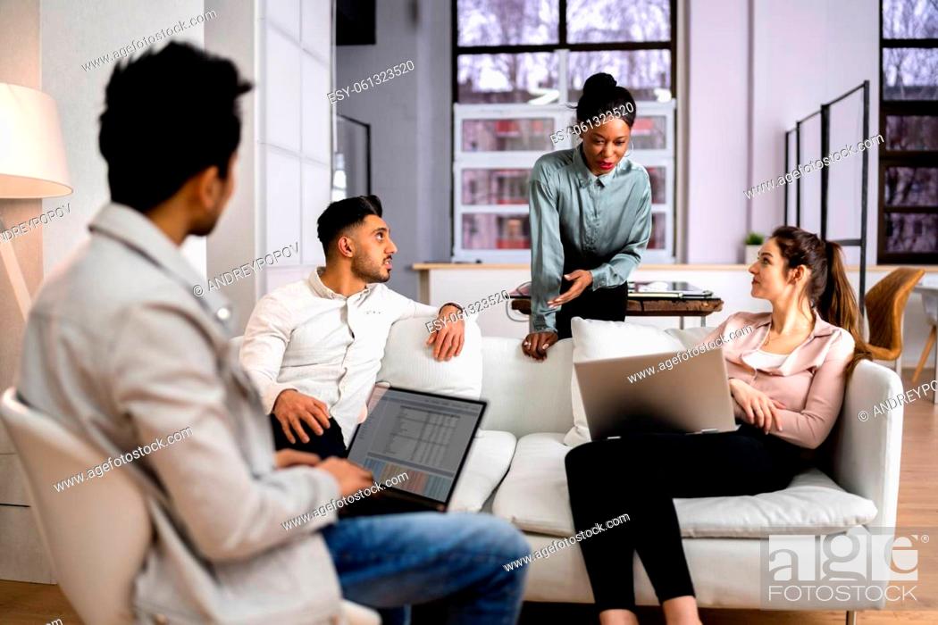 Stock Photo: Young Diverse People Working In Coliving Space.