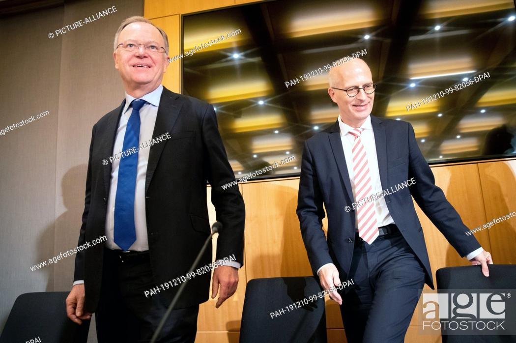 Stock Photo: 10 December 2019, Hamburg: Peter Tschentscher (SPD, r), First Mayor of Hamburg, and Stephan Weil (SPD), Prime Minister of Lower Saxony.