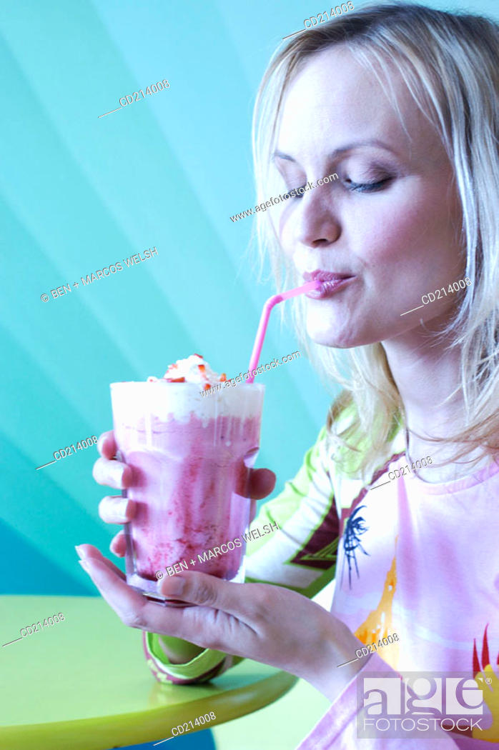 Stock Photo: Woman drinking ice-cream.