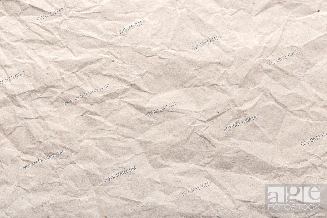 Stock Photo: Crumpled paper background texture. Brown paper background.
