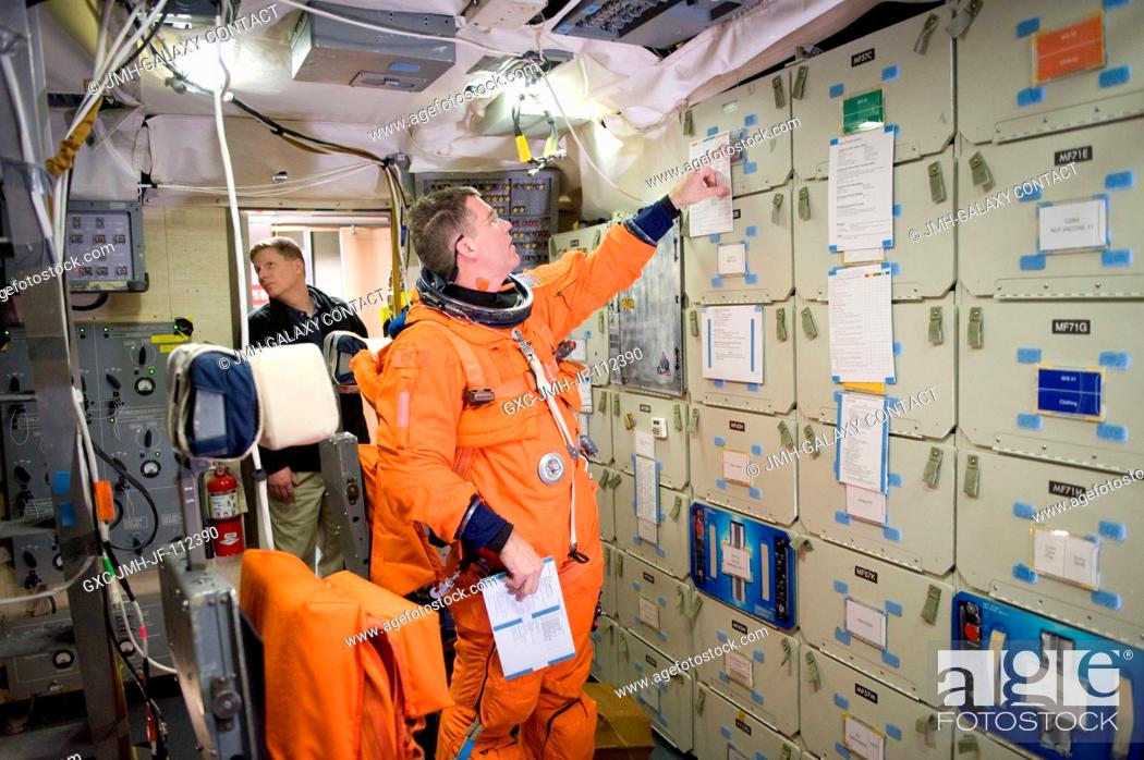 Stock Photo: NASA astronaut Steve Bowen, STS-133 mission specialist, attired in a training version of his shuttle launch and entry suit.