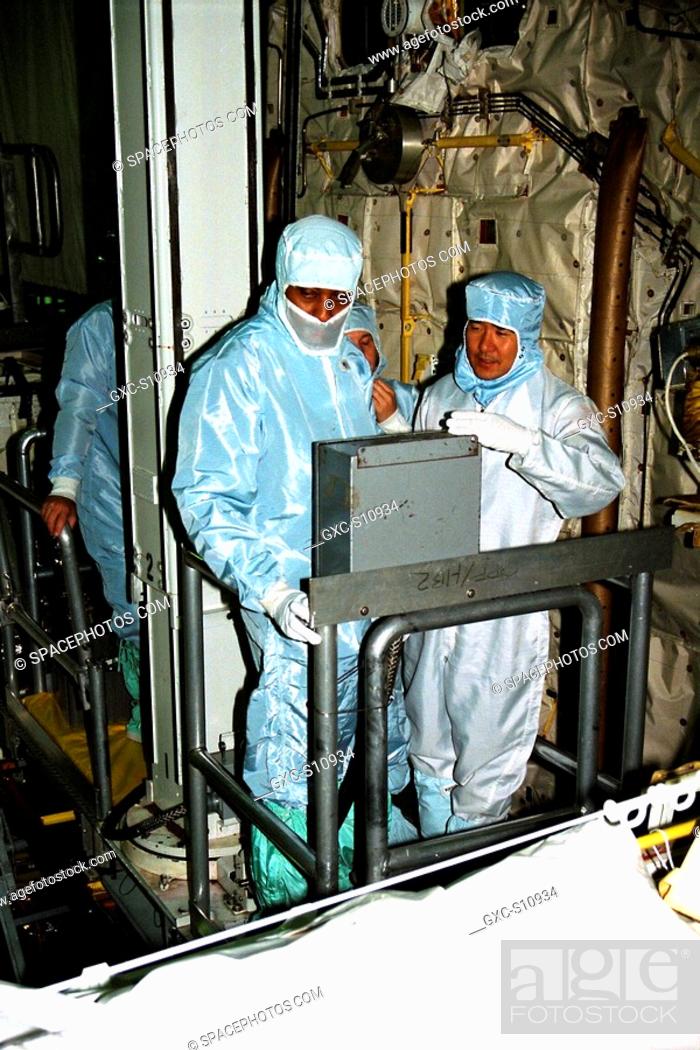 Stock Photo: 10/02/1997 --- Participating in the Crew Equipment Integration Test CEIT at Kennedy Space Center are STS-87 crew members Winston Scott, at left, and Takao Doi.