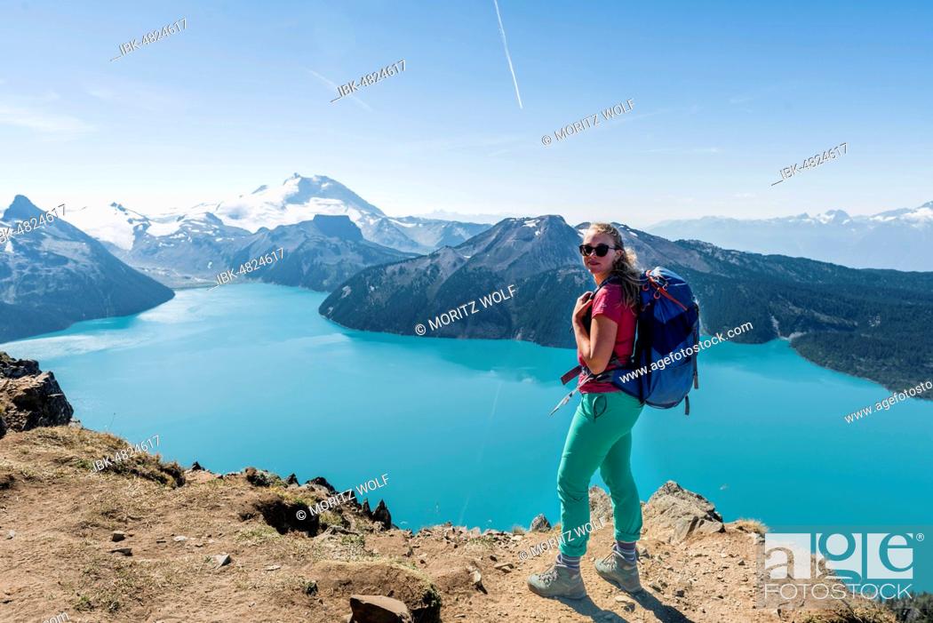 Stock Photo: View from Panorama Ridge Hiking Trail, Hiker, Garibaldi Lake, Guard Mountain and Deception Peak, Glacier, Garibaldi Provincial Park, British Columbia, Canada.