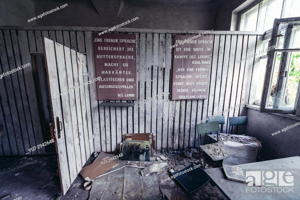 Stock Photo: Language classroom in secondary school in Mashevo abandoned village of Chernobyl Nuclear Power Plant Zone of Alienation in Ukraine.