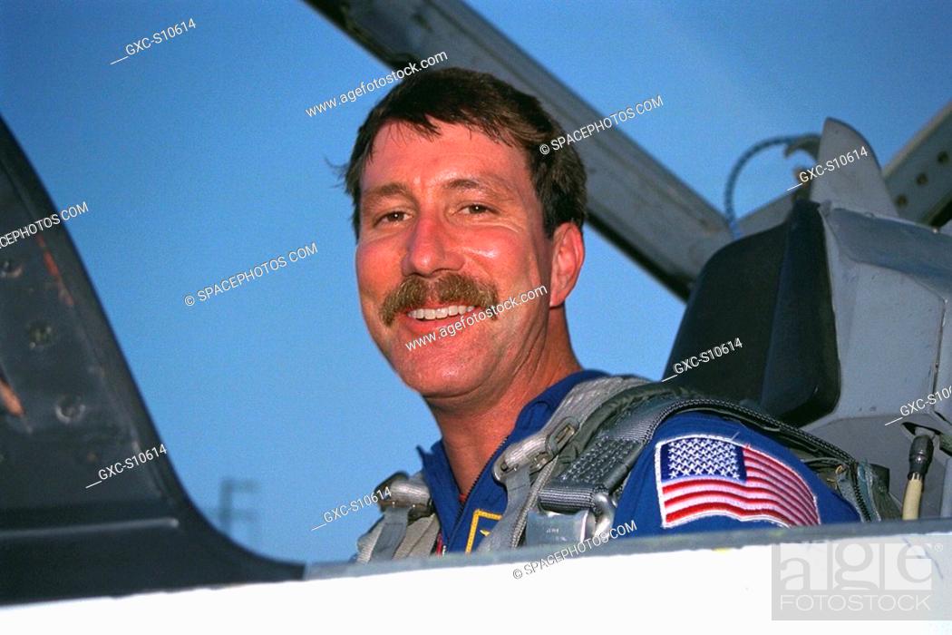 Stock Photo: 07/20/1997 --- STS-85 Pilot Kent V. Rominger poses in his T-38 jet trainer after landing with other members of the flight crew at KSC’s Shuttle Landing Facility.