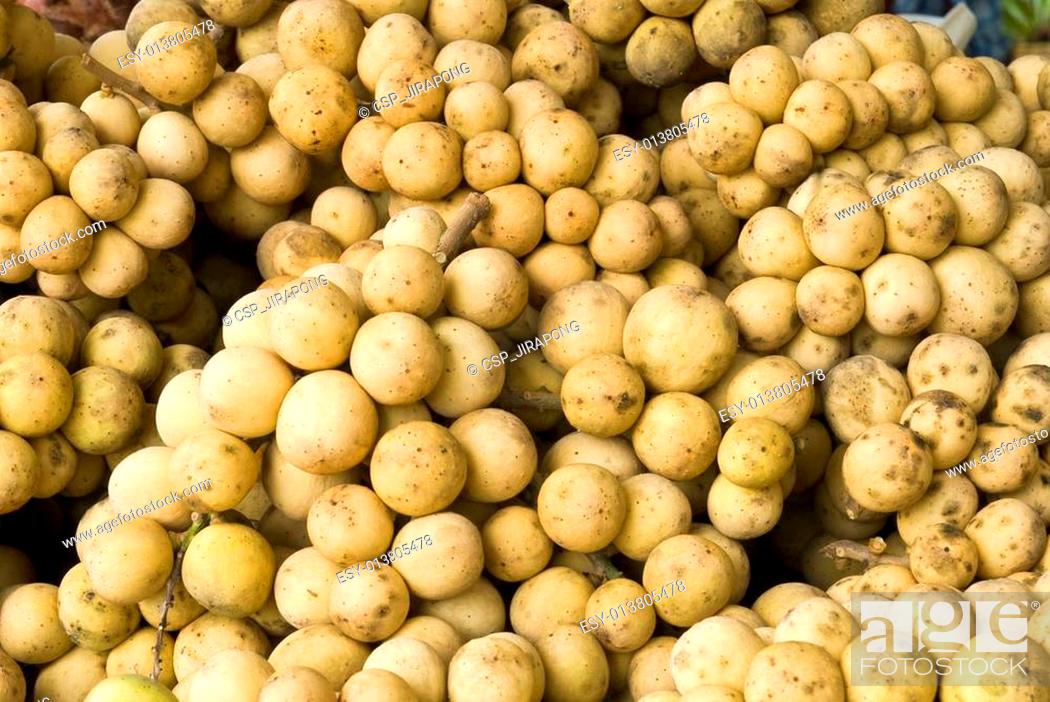 Stock Photo: Longkong, delicious tropical fruit in fruit stall, Thailand.