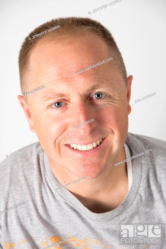 Stock Photo: 40 year old man smiles at the camera.