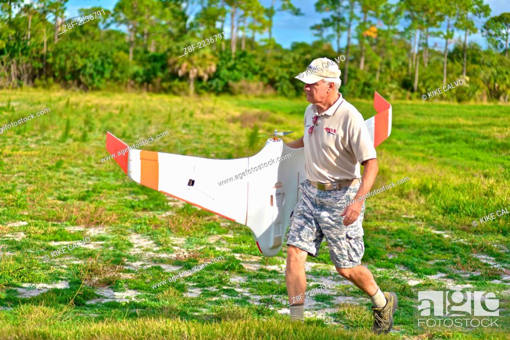 Stock Photo: Instructor Gene Payson holds a classic flying wing at a small unmanned aircraft pilot training course at the Unmanned Vehicle University.