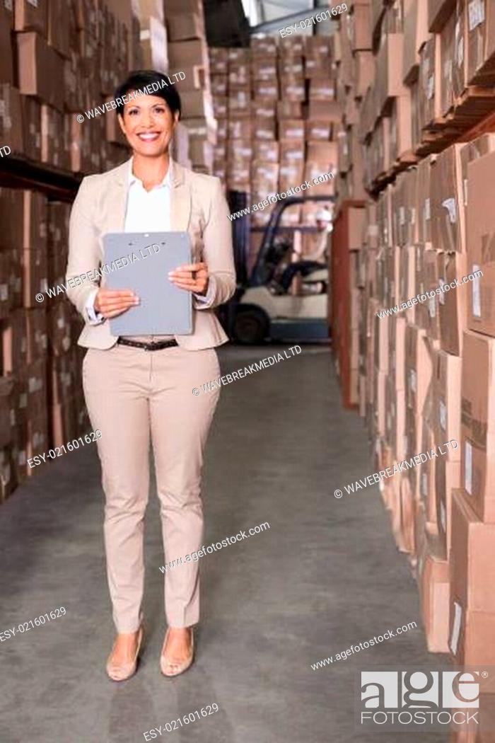 Stock Photo: Warehouse manager smiling at camera.