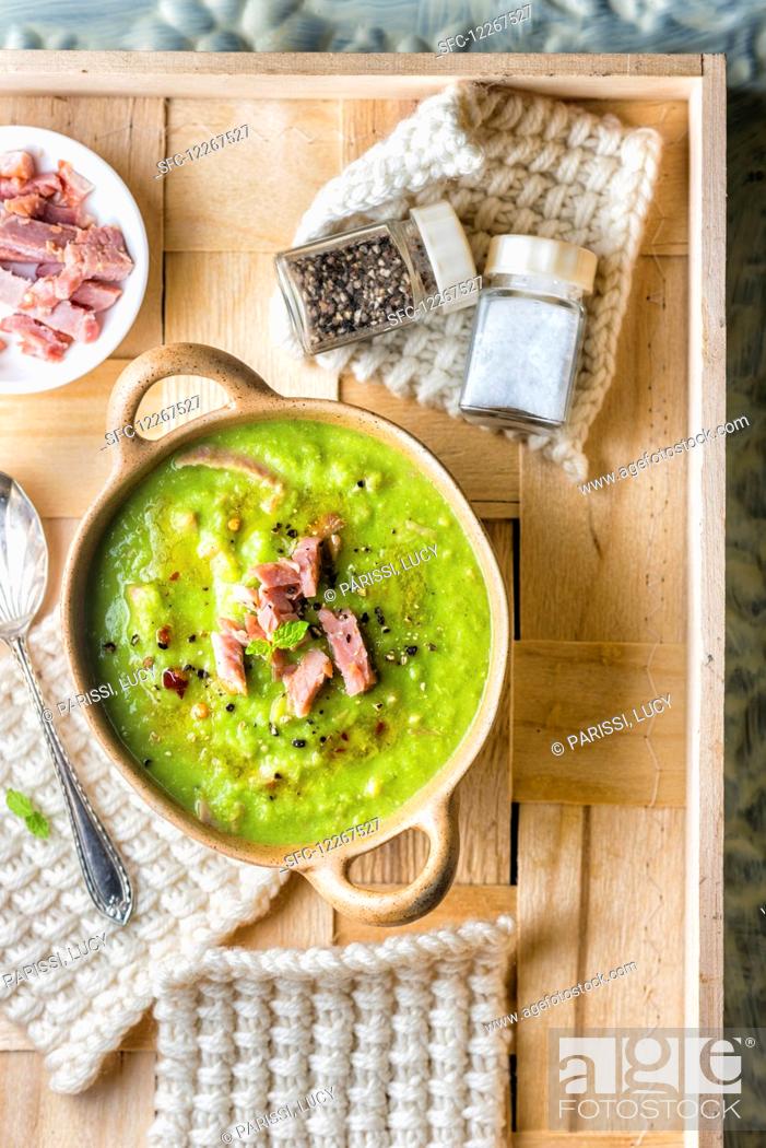 Stock Photo: Pea soup with ham and peppermint.