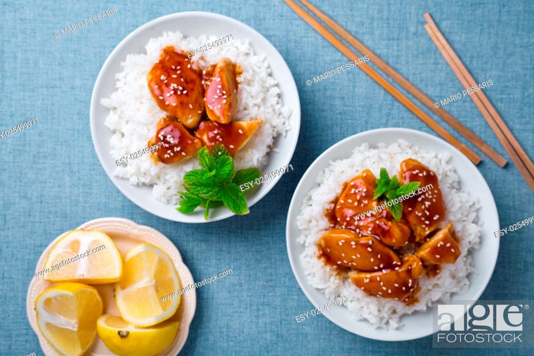 Stock Photo: Photograph of a bowl of thai chicken with rice and sesame.