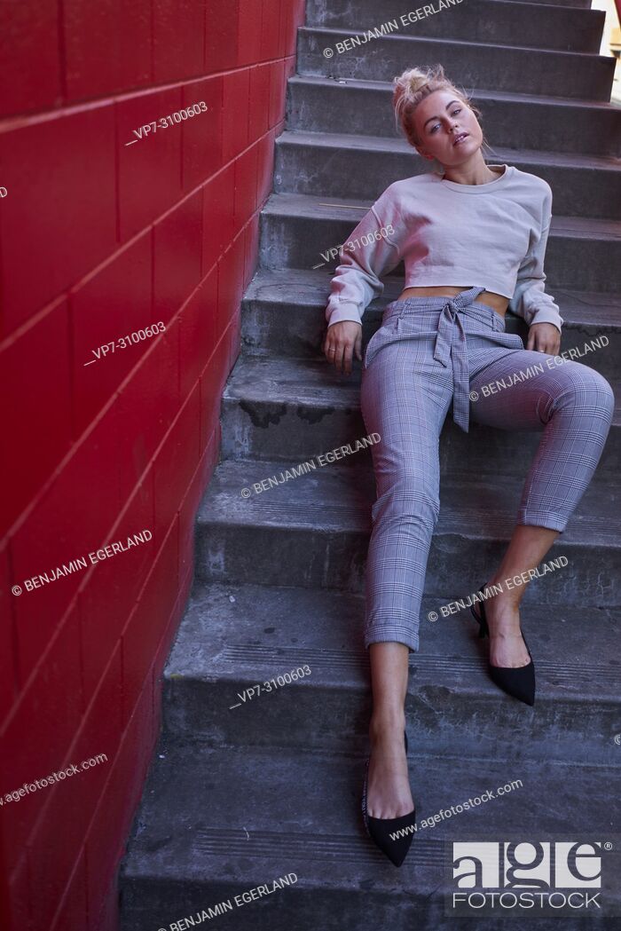 Imagen: Australia, Adelaide, women's fashion blogger and actress Sarah Jeavons laying on stairs, sensitive, feelings.