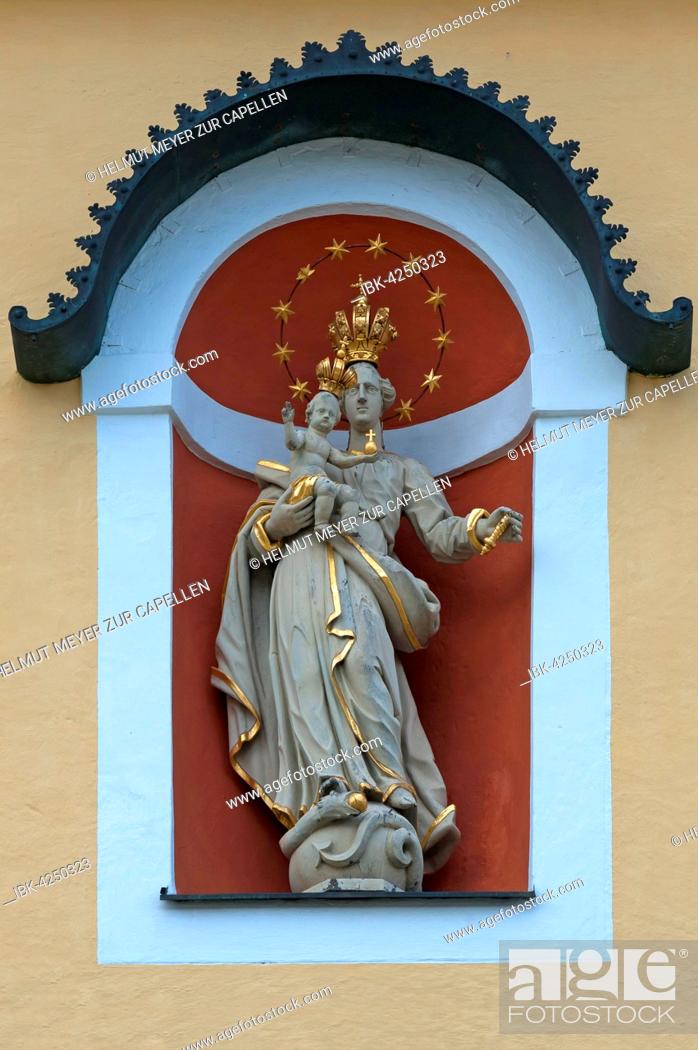 Stock Photo: Sculpture of St. Mary Immaculate with baby Jesus, St. Johann deanery parish church, St. Johann, Tyrol, Austria.