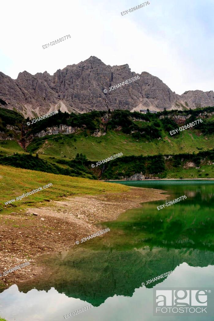 Stock Photo: Lachenspitze with reflection in lake Traualpsee.