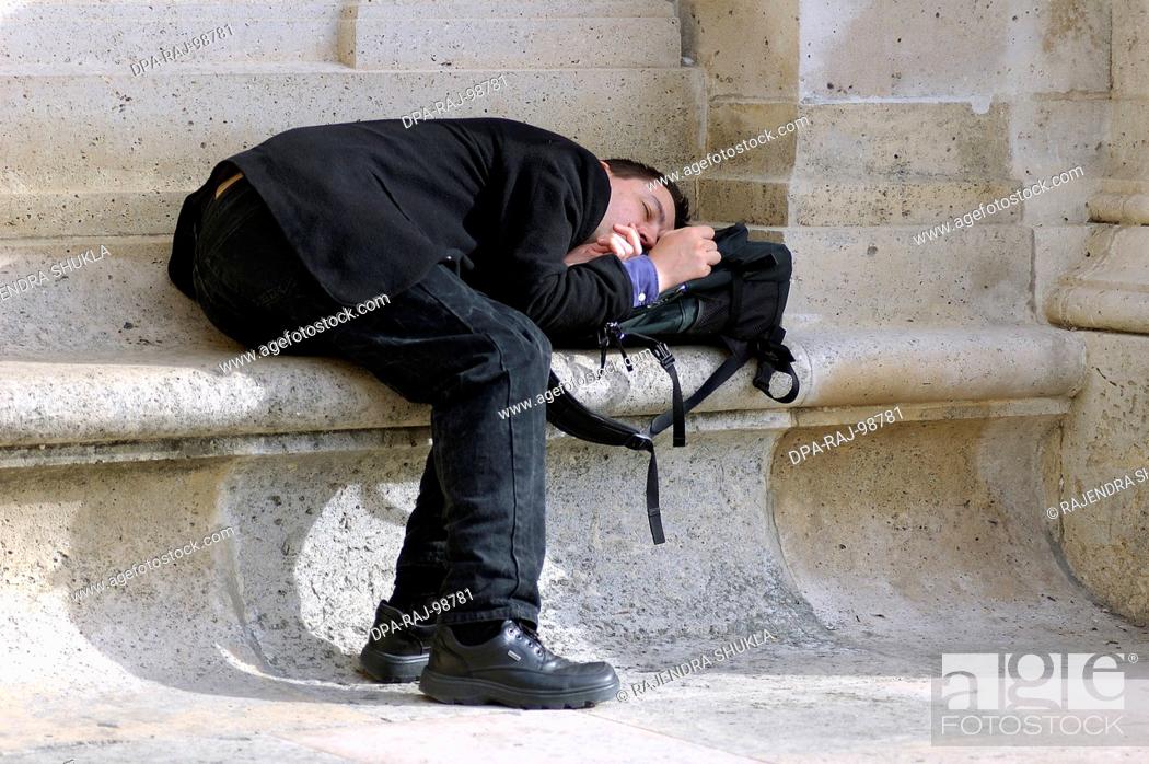 person sleeping in a funny unusual posture , Paris , France, Stock Photo,  Picture And Rights Managed Image. Pic. DPA-RAJ-98781 | agefotostock