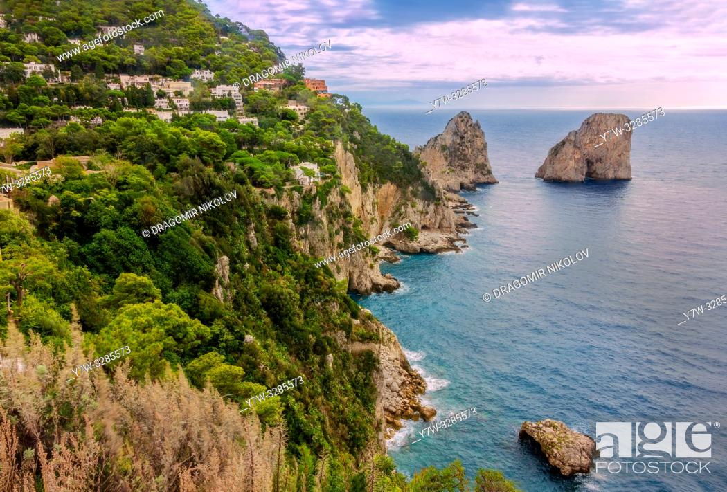 Stock Photo: Sea view by Capri island, Italy. The rocks are famous as Faraglioni rock. Locals say that they have seen sirens on this rock and often hear their whistling.