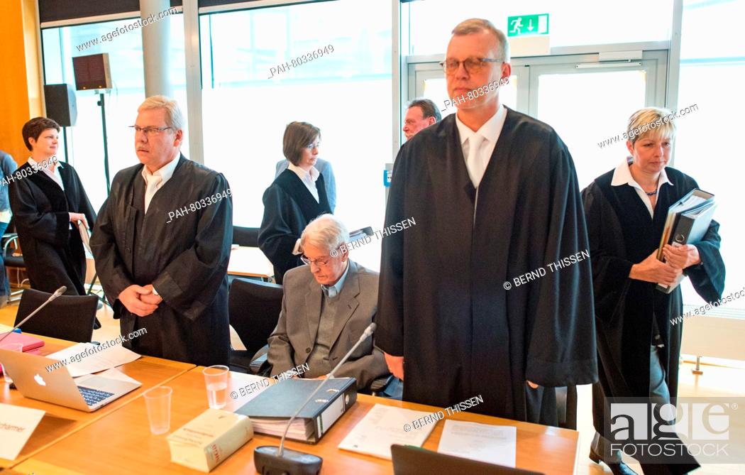 Stock Photo: Defendant Reinhold Hanning (C) sits in the dock next to his lawyers Andreas Scharmer (L) and Johannes Salmen (R) as judge Anke Grudda enters the courtroom.