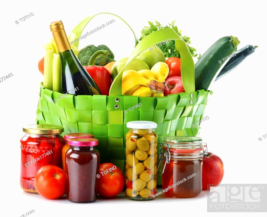 Stock Photo: Green shopping bag with groceries isolated on white background.