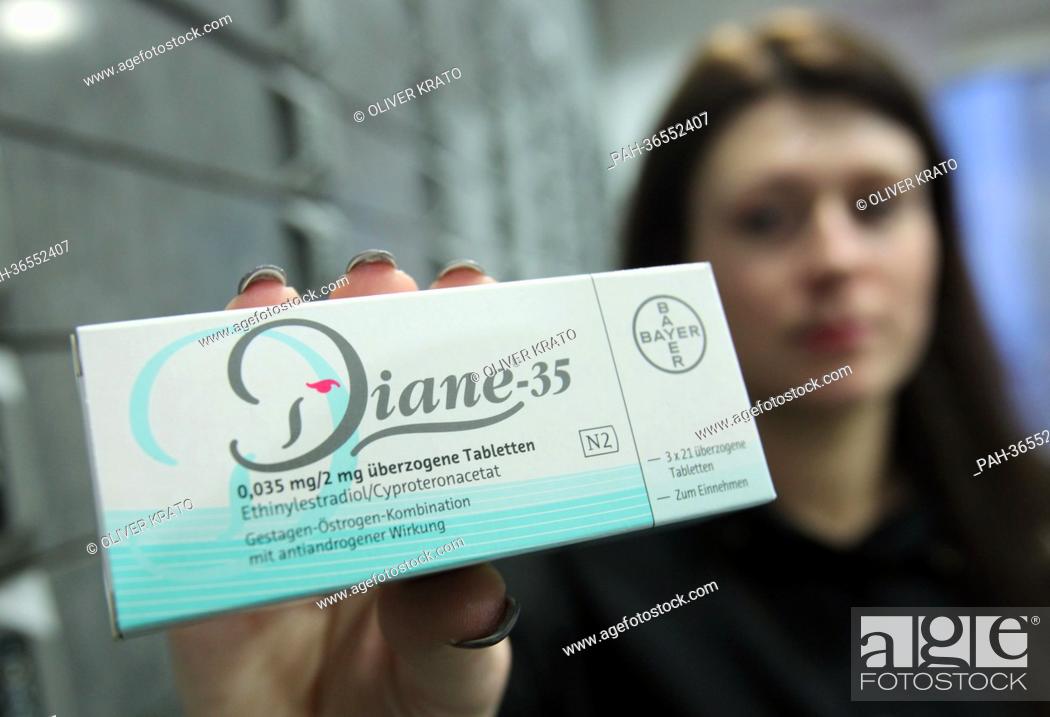 Stock Photo: A pharmaceutical assistant holds a pack of the contraceptive Diane 35 in Luebbecke, Germany, 30 January 2013. The acne medicine by Bayer often prescribed as a.