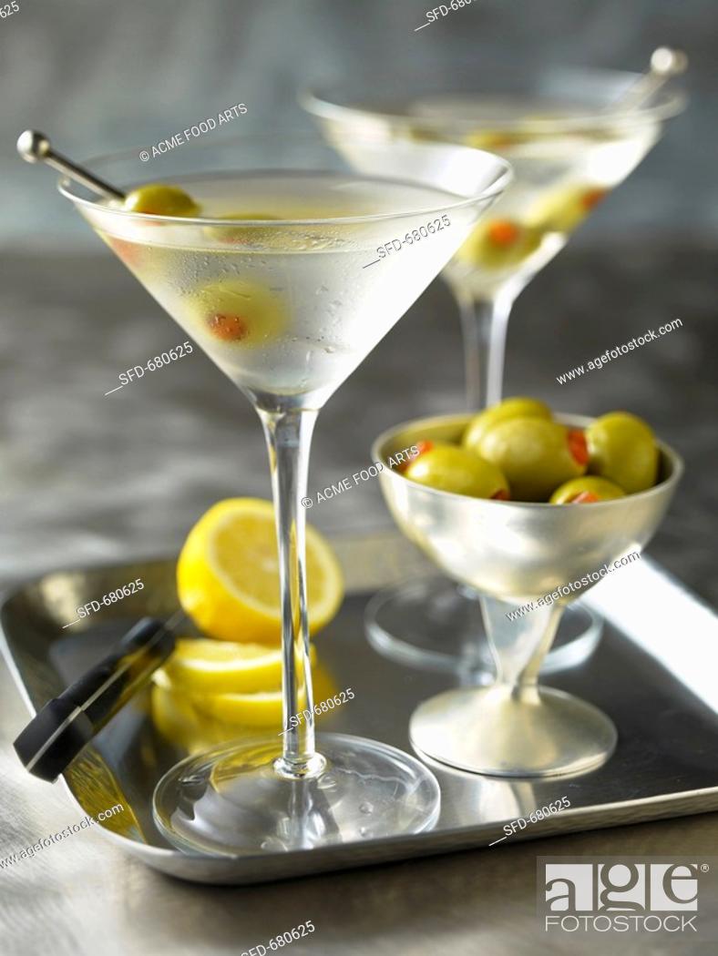 Stock Photo: Two Martinis with olives on a tray.