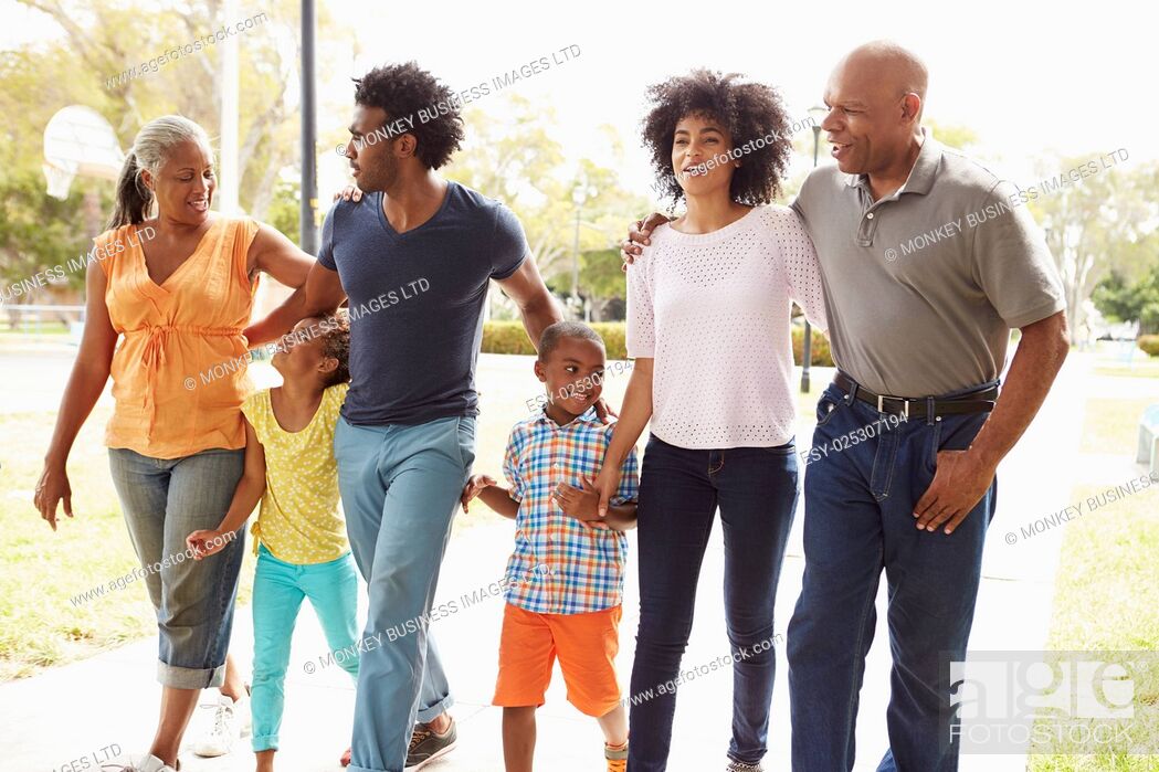Stock Photo: Multi Generation Family Walking In Park Together.