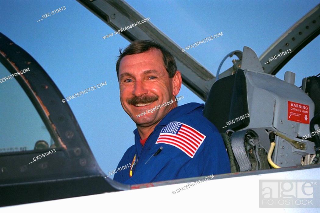 Stock Photo: 07/20/1997 --- STS-85 Mission Commander Curtis L. Brown, Jr., poses in his T-38 jet trainer after landing with his crew at KSC’s Shuttle Landing Facility from.