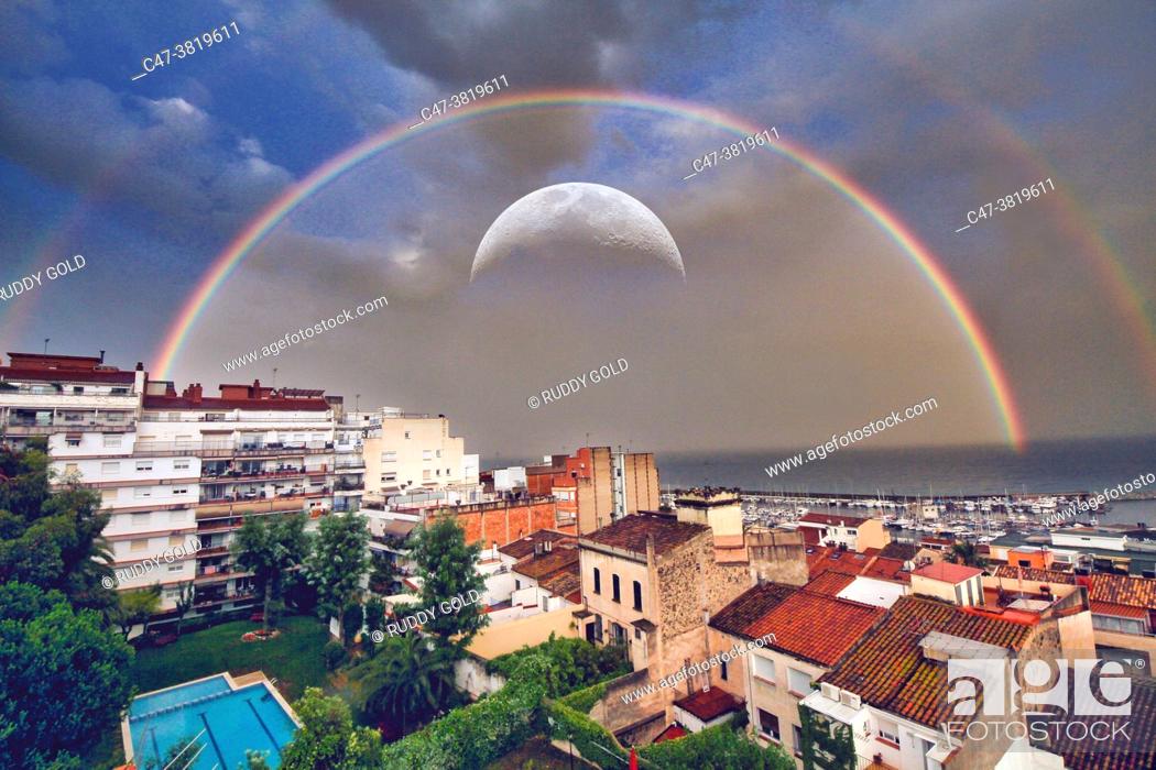 Stock Photo: Double rainbow and big moon over the residential area of El Masnou. Barcelona. El Masnou is a municipality in the province of Barcelona.
