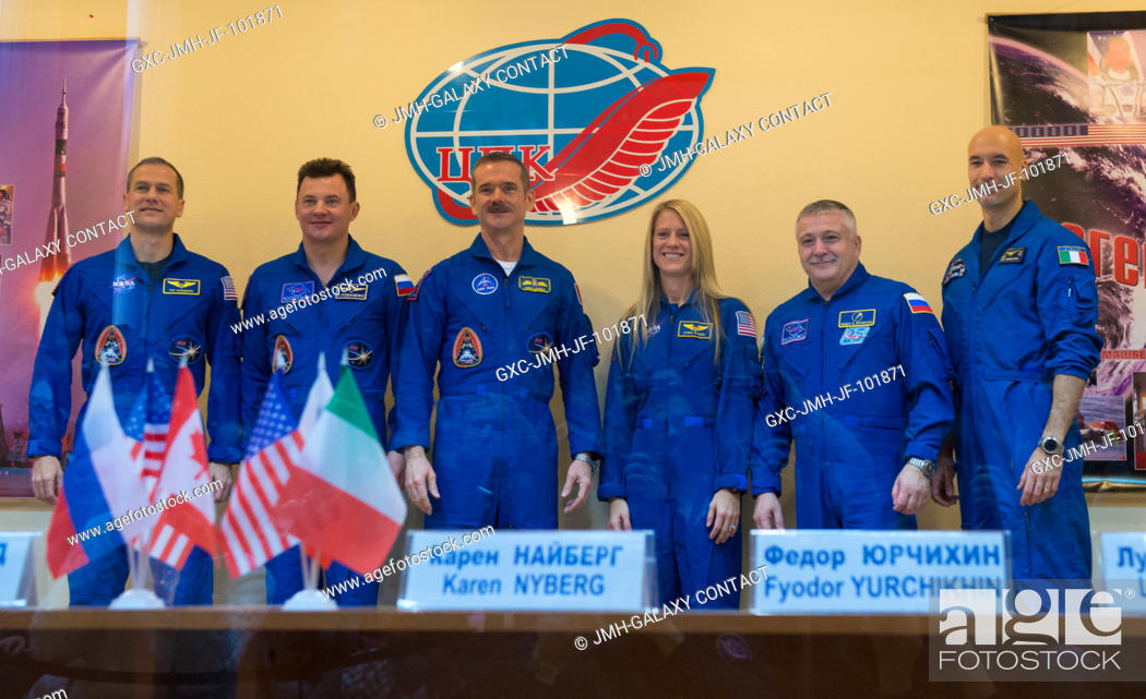 Stock Photo: Expedition 34 prime crew members from left: Flight Engineer Tom Marshburn of NASA, Soyuz Commander Roman Romanenko, Flight Engineer Chris Hadfield of the.