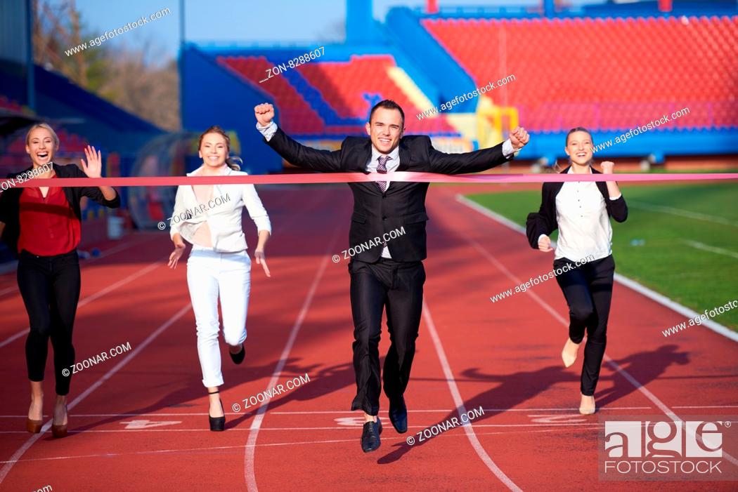 Stock Photo: business people running together on athletics racing track.