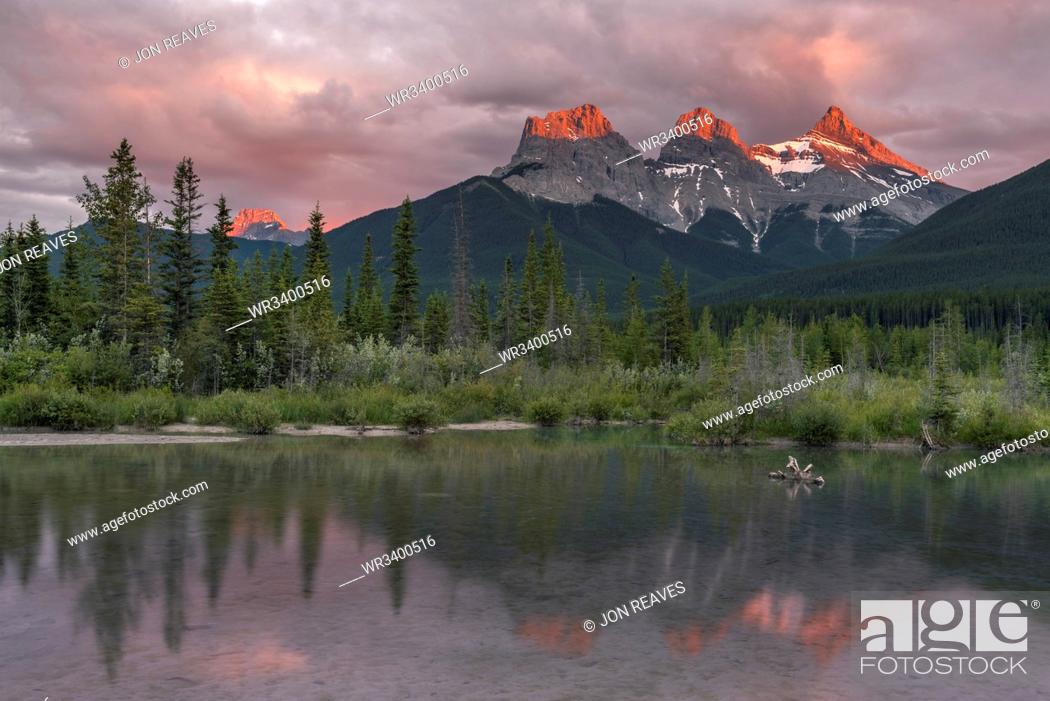 Stock Photo: Sunset and Alpenglow on the peaks of Three Sisters, Canmore, Alberta, Canadian Rockies, Canada, North America.