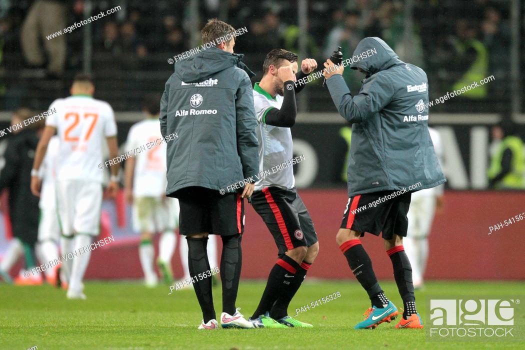 Stock Photo: Frankfurt's Haris Seferovic (C) and Bamba Anderson perform a winner's dance after the final whistle in the Bundesliga soccer match between Eintracht Frankfurt.