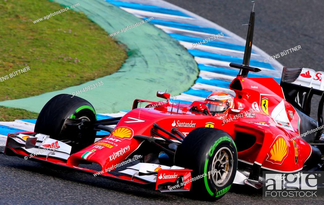 Stock Photo: Finnish Formula One driver Kimi Raikkonen of Ferrari steers the new F14 T during the training session for the upcoming Formula One season at the Jerez racetrack.