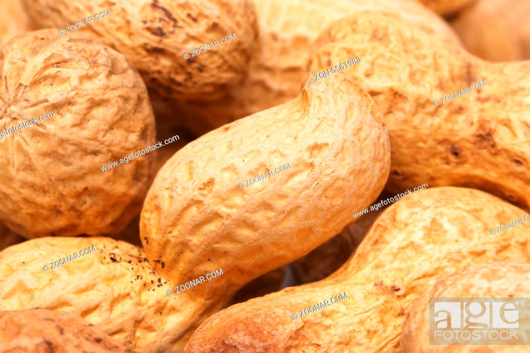 Stock Photo: close-up of some peanuts. background of some peanuts.