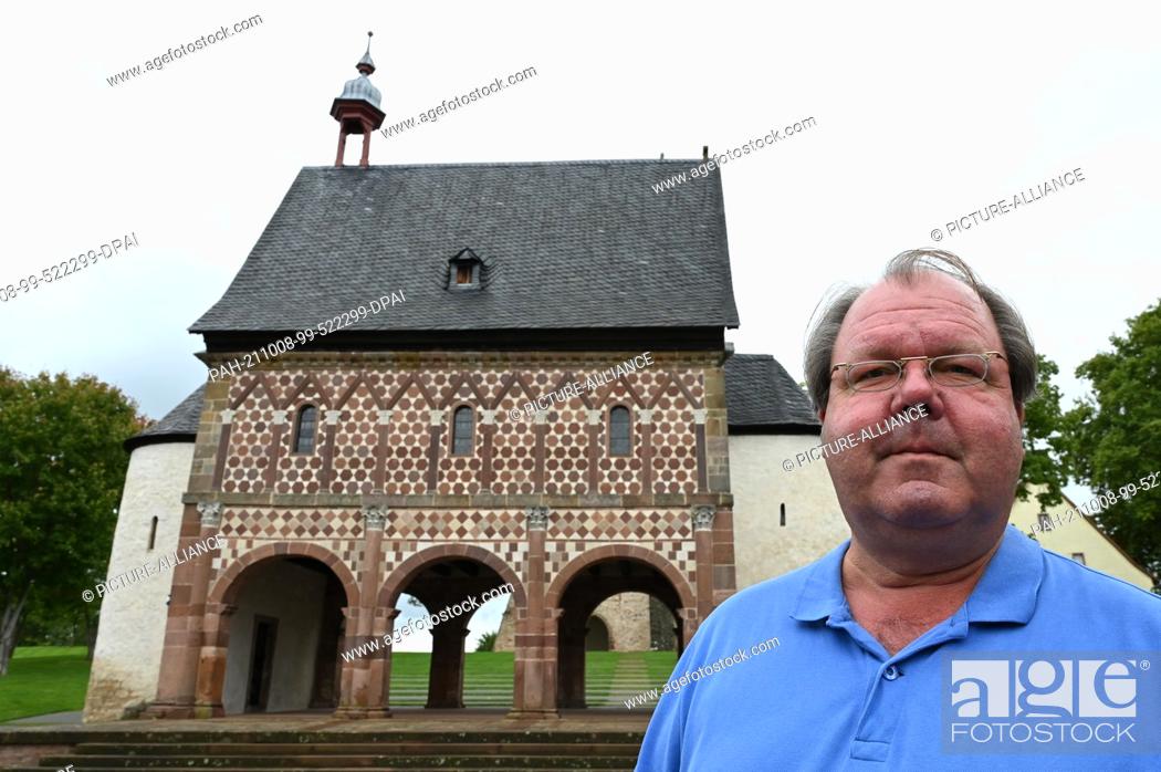 Stock Photo: 29 September 2021, Hessen, Lorsch: Hermann Schefers, Director of the Lorsch Monastery World Heritage Site, stands in front of the so-called Gate Hall or King's.