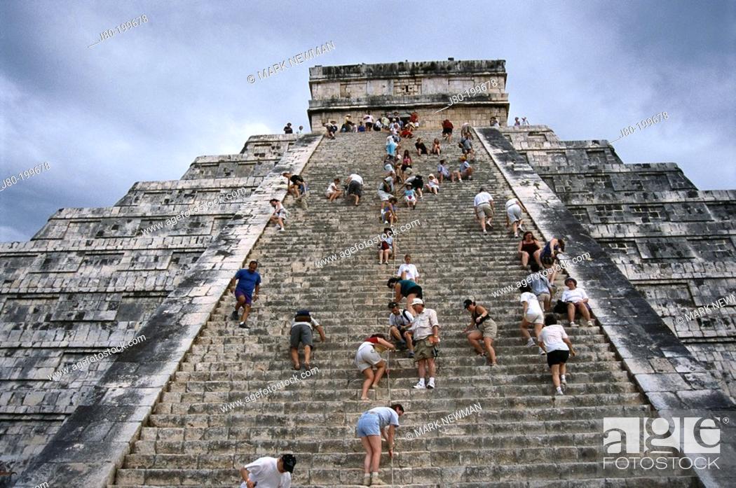 chichen itza tourist climbs pyramid