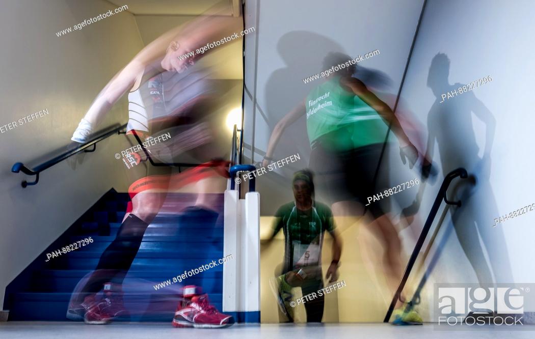 Stock Photo: Contestants running in a stairwell in Hanover, Germany, 18 February 2017. The contestants have to run up and down the stairs of a thirteen storey building in.