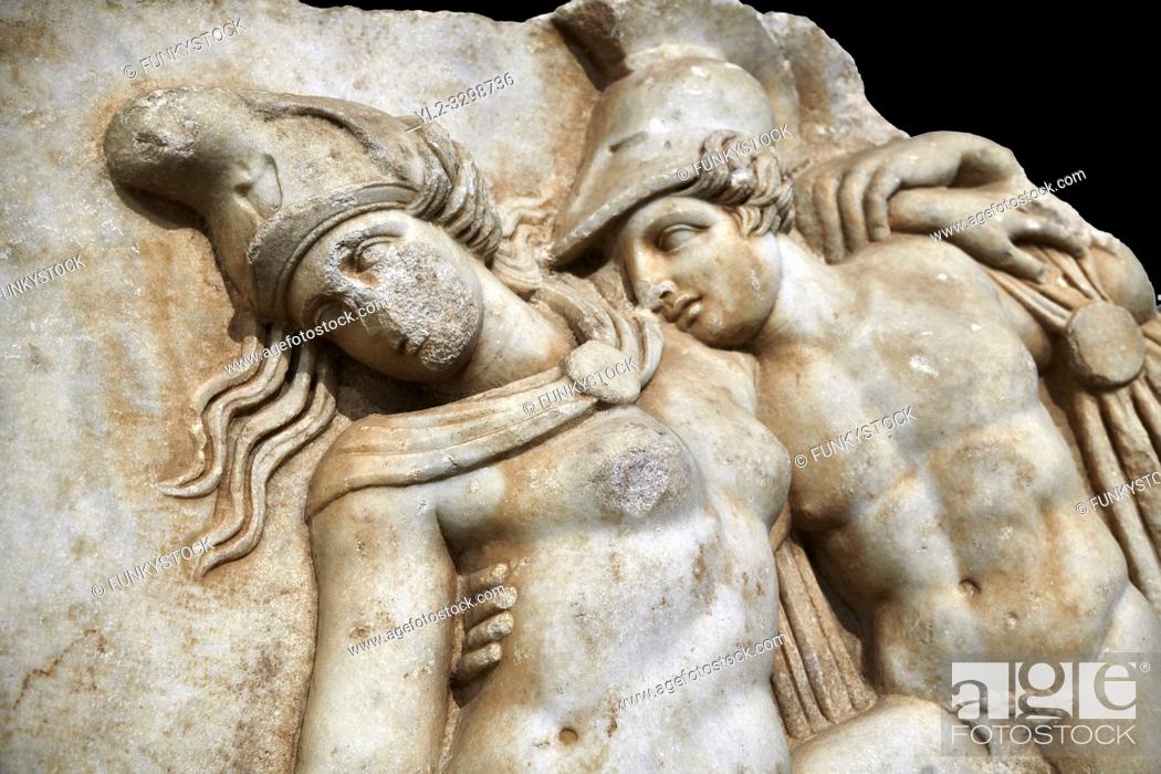 Stock Photo: Detail of a Roman Sebasteion relief sculpture of Achilles and a dying Amazon, Aphrodisias Museum, Aphrodisias, Turkey. Against a black background. .