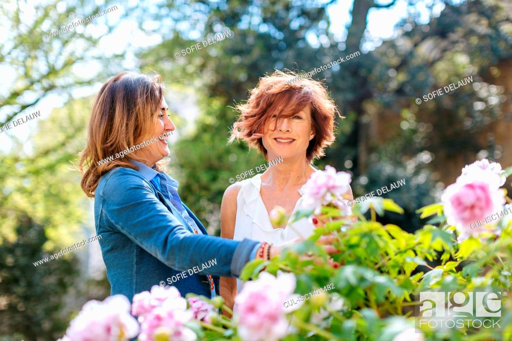 Stock Photo: Two women, in rural setting, laughing.