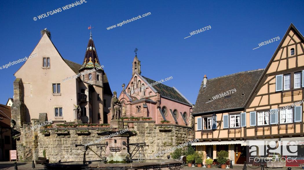 Stock Photo: France, Alsace, Eguisheim, Fortress and chapel, fountain in foreground.