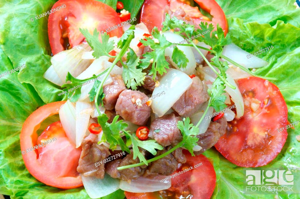 Stock Photo: Vietnamese food, bo luc lac, nutrition and delicious eating, beef fry with spice, onion, garlic, eat with salad, tomato, cooked rice.