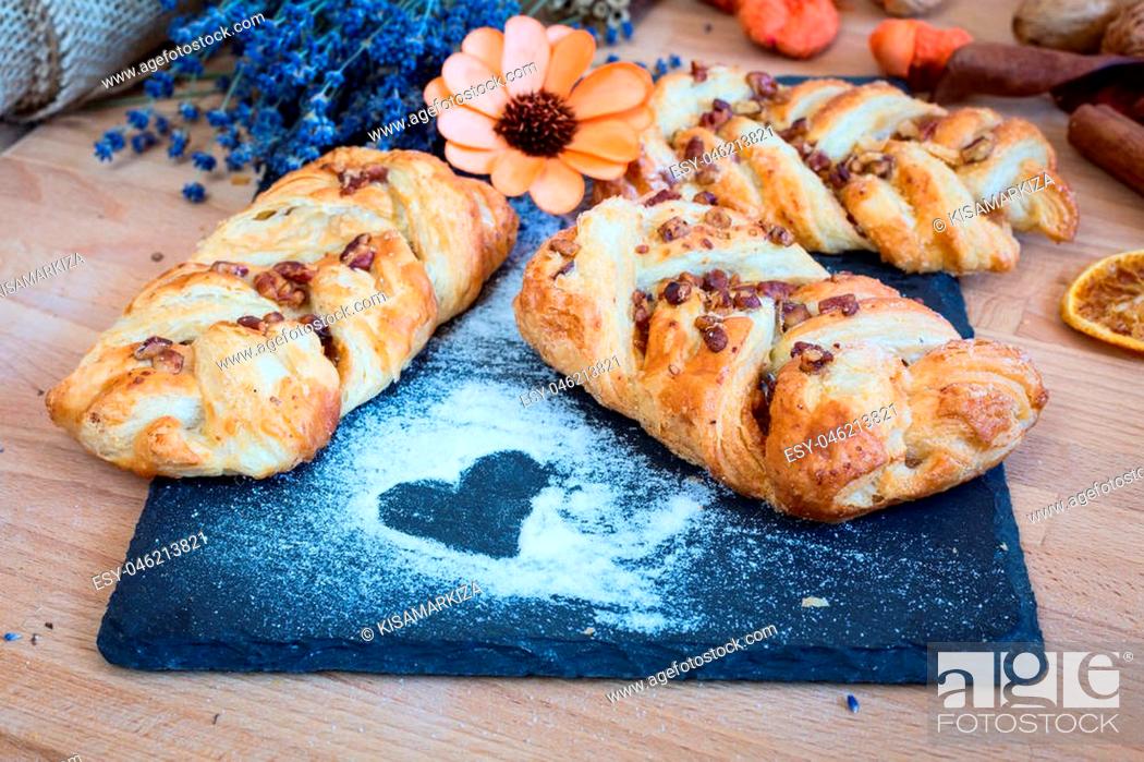 Stock Photo: marple and pecan plait pastry sweet food breakfast with heart sign and lavender flowers.